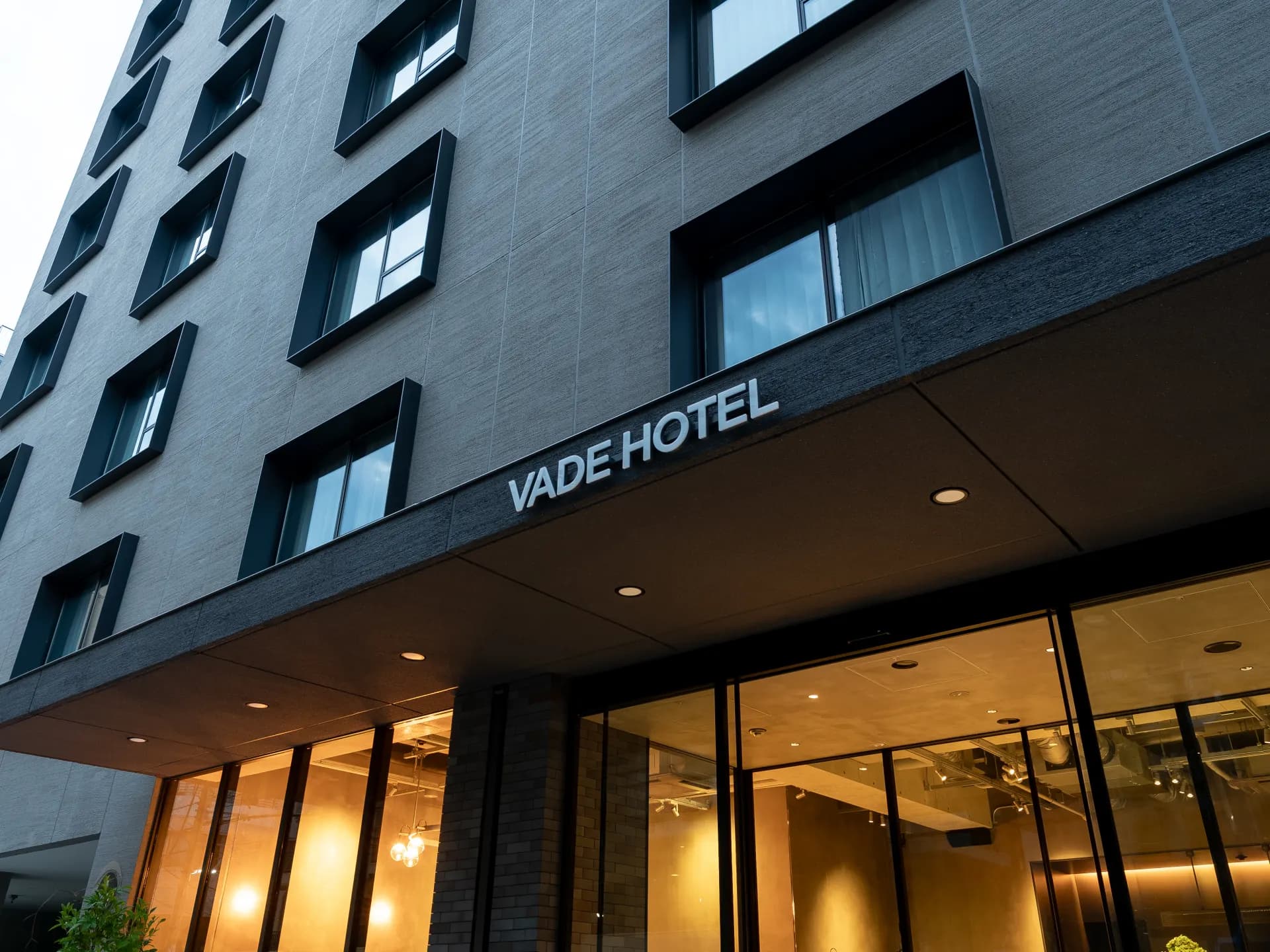 Exterior of VADE HOTEL SHIBUYA with the hotel sign